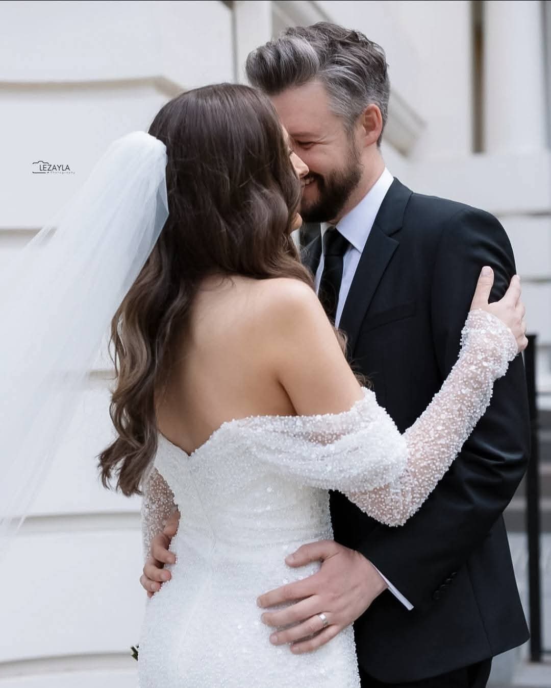 Wedding couple embrace
